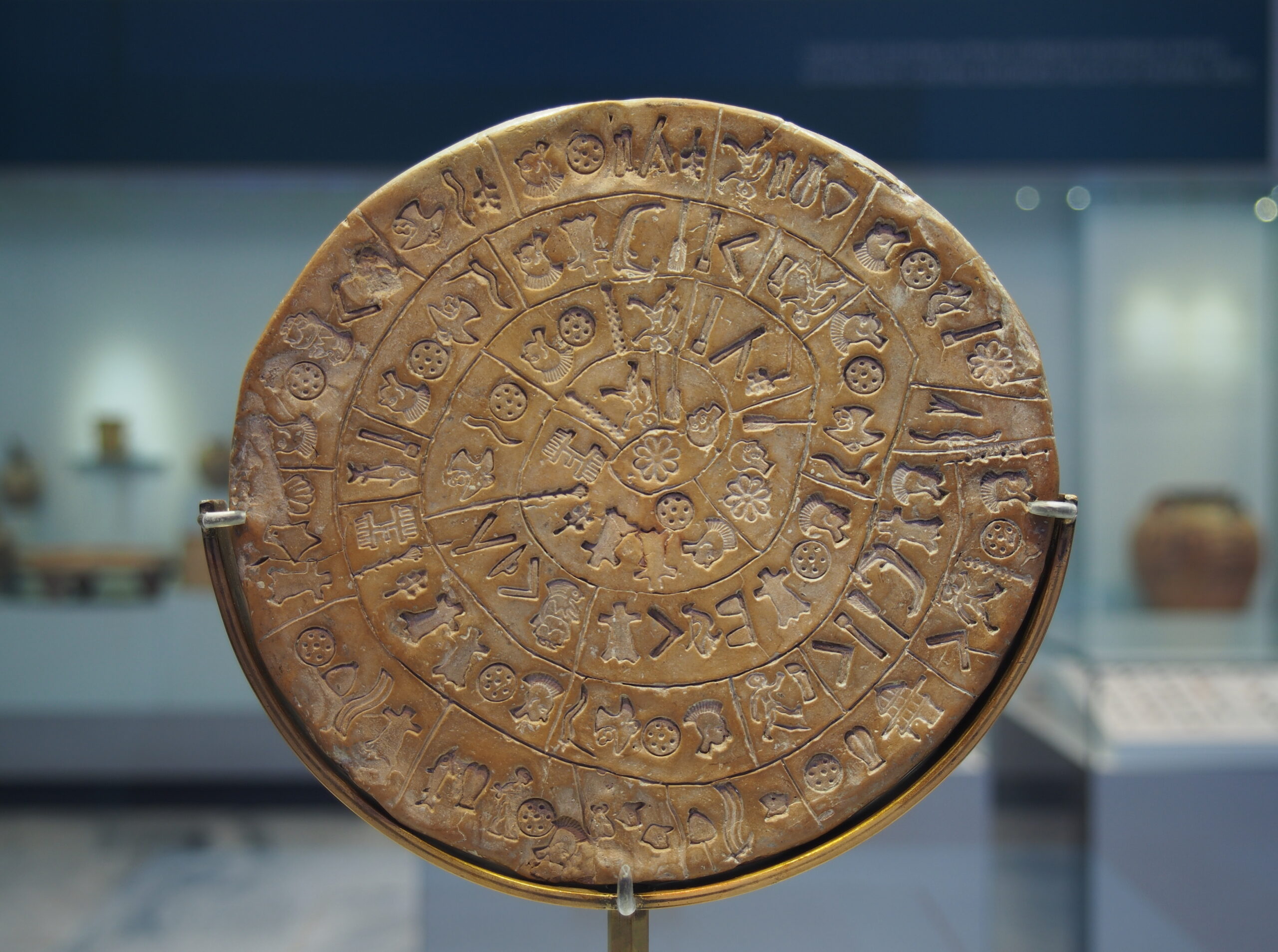 Side A of the Phaistos Disc with stamped signs arranged in a spiral